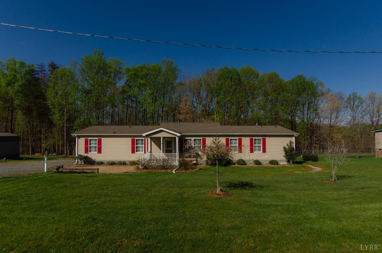 309 Lakeside Road Penhook, VA 24137 - Photo 1 of 61 a front view of a house with garden