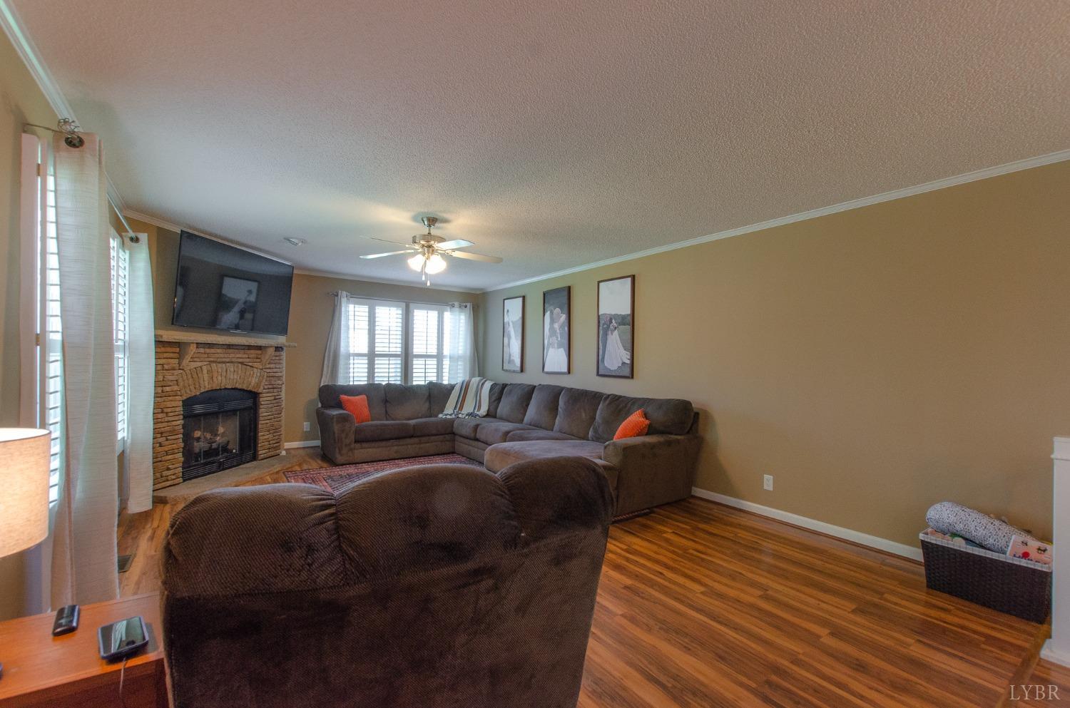 309 Lakeside Road Penhook, VA 24137 - Photo 14 of 61 a bed room with a bed and a fireplace