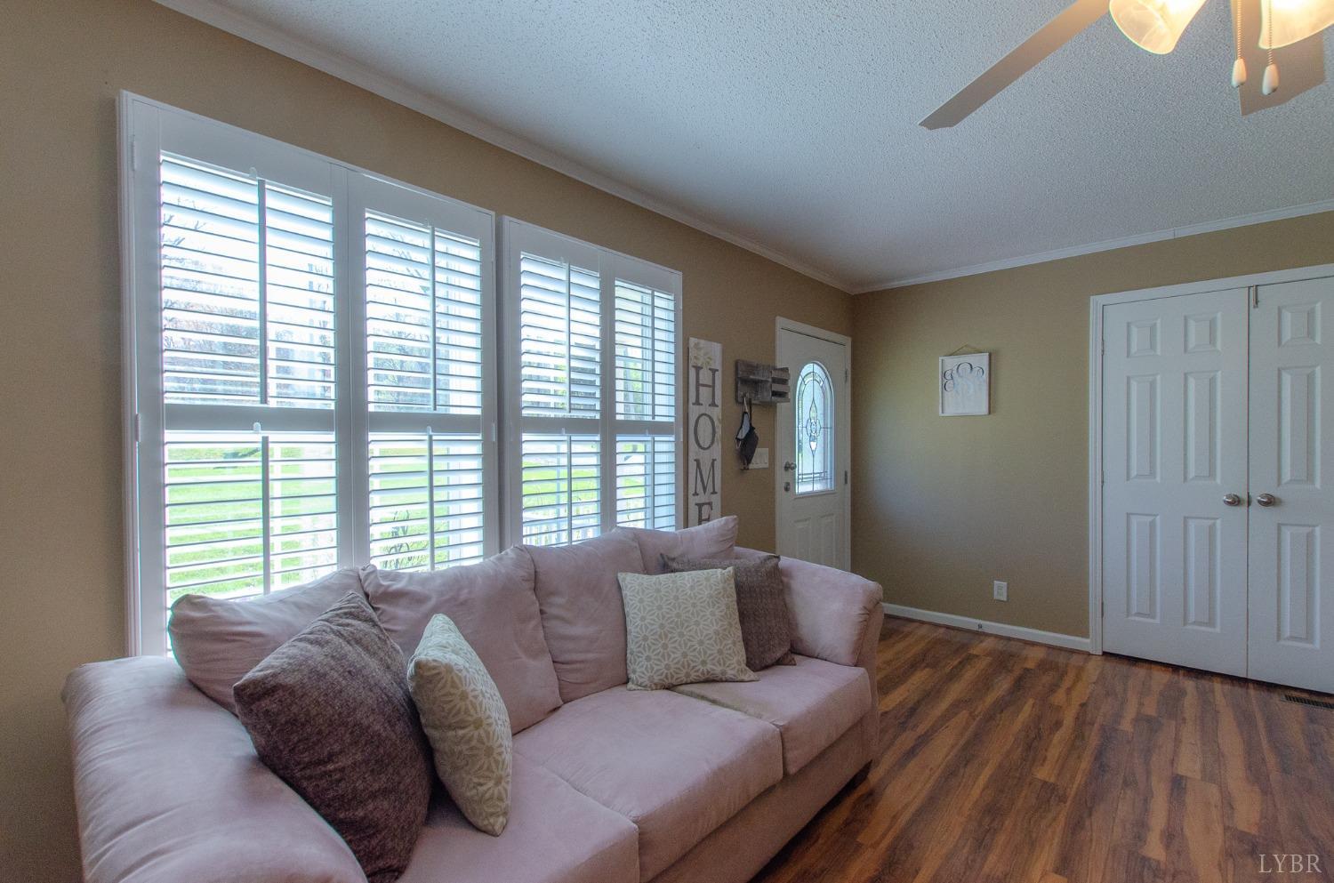 309 Lakeside Road Penhook, VA 24137 - Photo 17 of 61 a living room with furniture and a large window