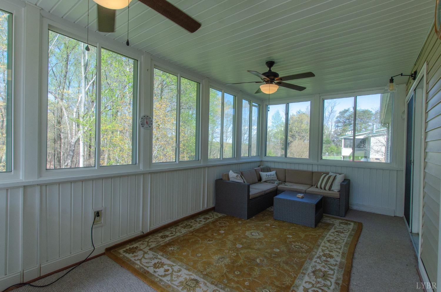 309 Lakeside Road Penhook, VA 24137 - Photo 20 of 61 a living room with furniture and a rug