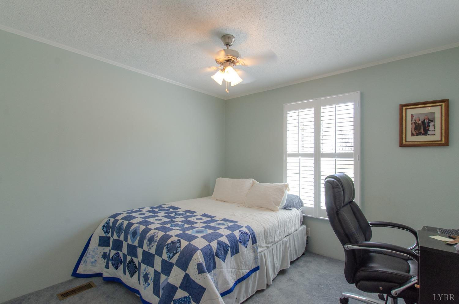 309 Lakeside Road Penhook, VA 24137 - Photo 27 of 61 a bedroom with a bed and chair