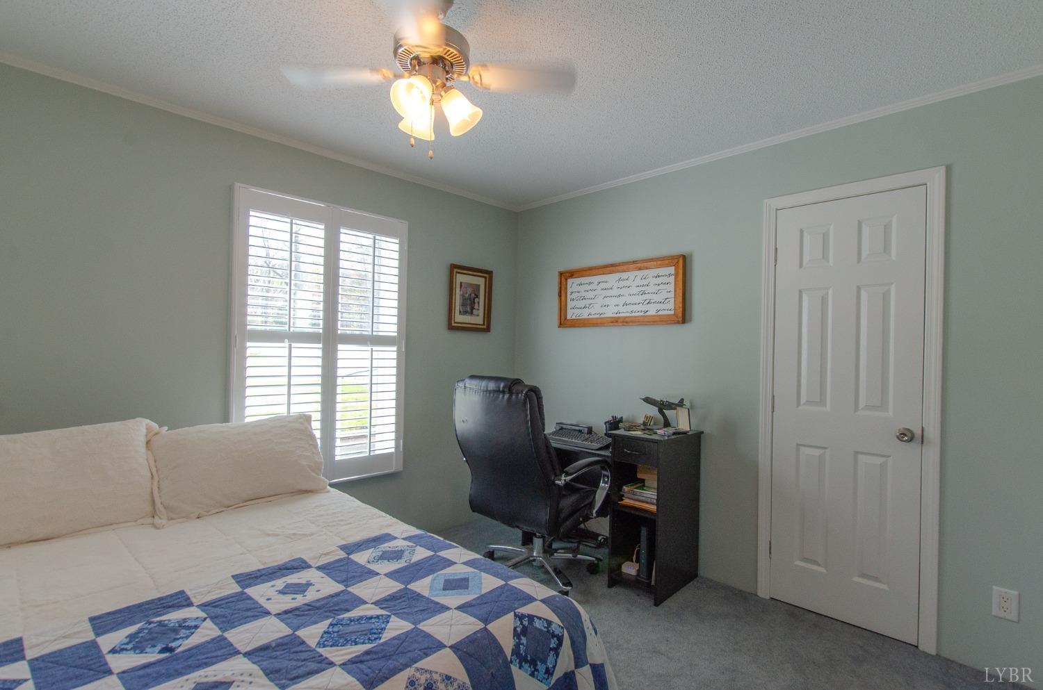 309 Lakeside Road Penhook, VA 24137 - Photo 28 of 61 a bedroom with a bed and a chair