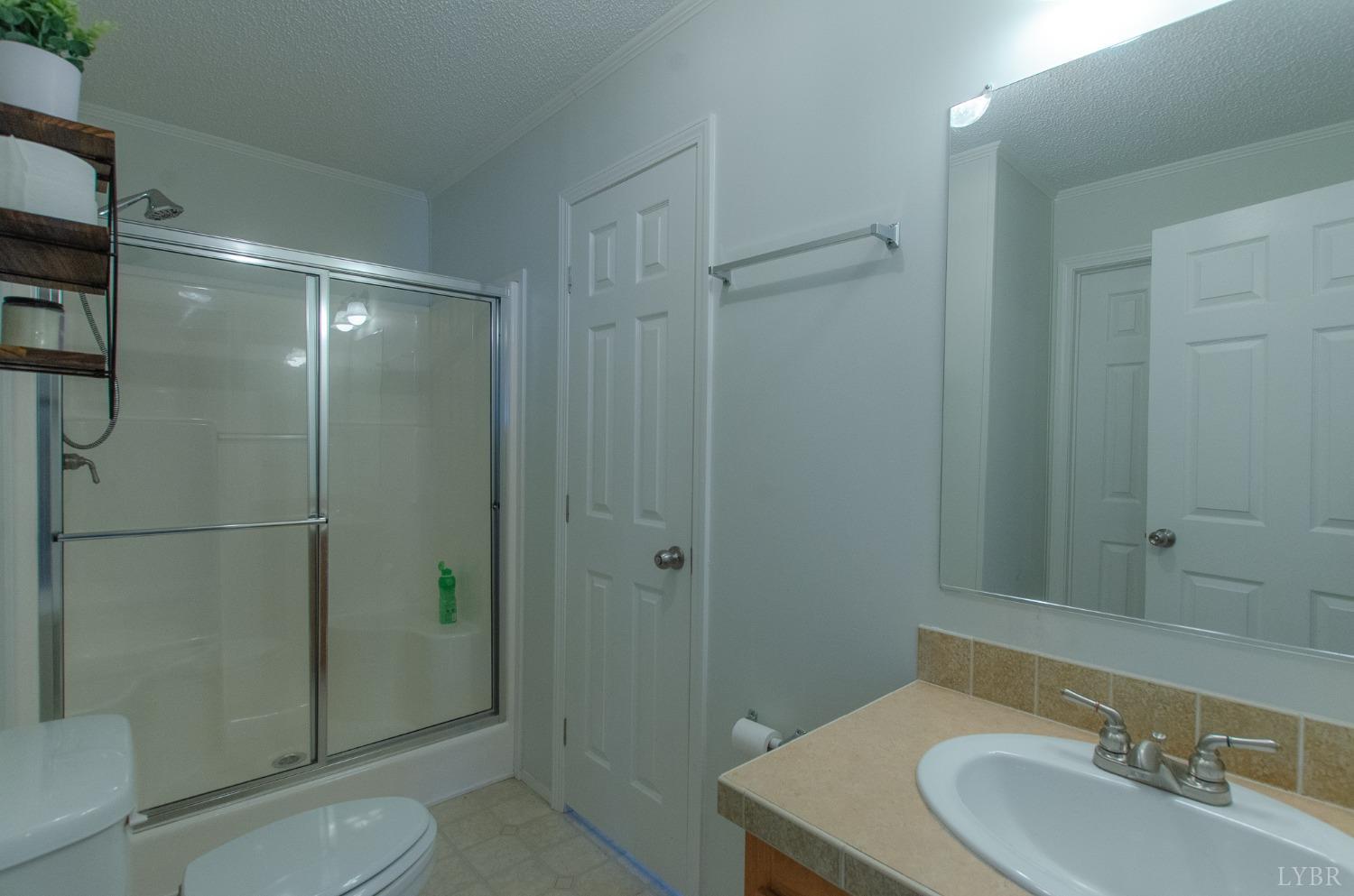 309 Lakeside Road Penhook, VA 24137 - Photo 33 of 61 a bathroom with a sink toilet and shower