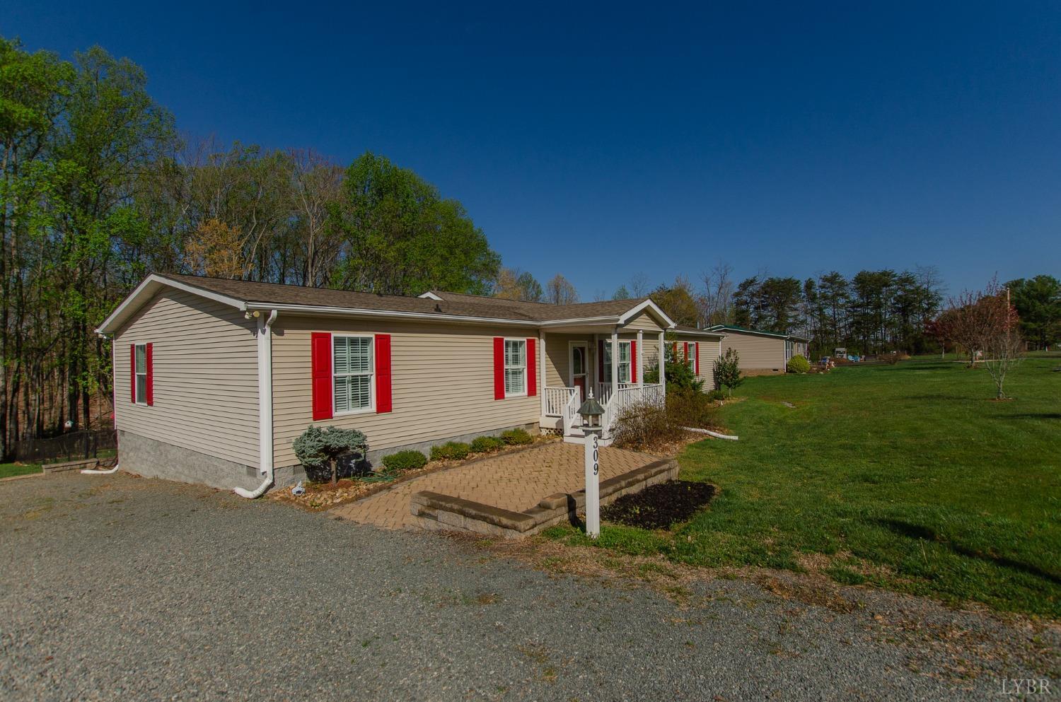 309 Lakeside Road Penhook, VA 24137 - Photo 42 of 61 a front view of a house with garden