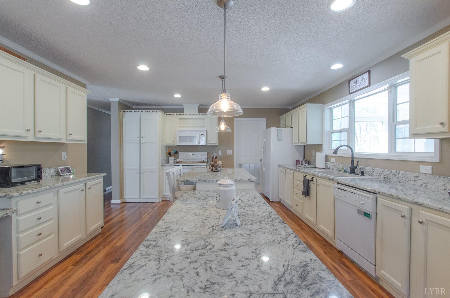 309 Lakeside Road Penhook, VA 24137 - Photo 6 of 61 a large kitchen with kitchen island a sink stainless steel appliances and window