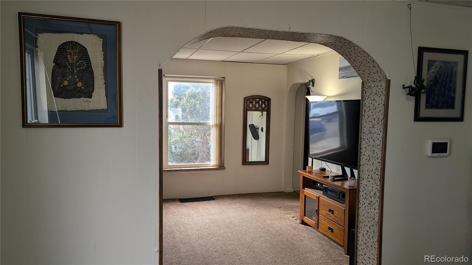 3924 Jason Street Denver, CO 80211 - Photo 12 of 26 a view of a livingroom with a window and storage area