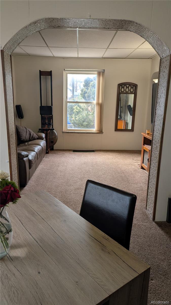 3924 Jason Street Denver, CO 80211 - Photo 13 of 26 a living room with furniture and a window