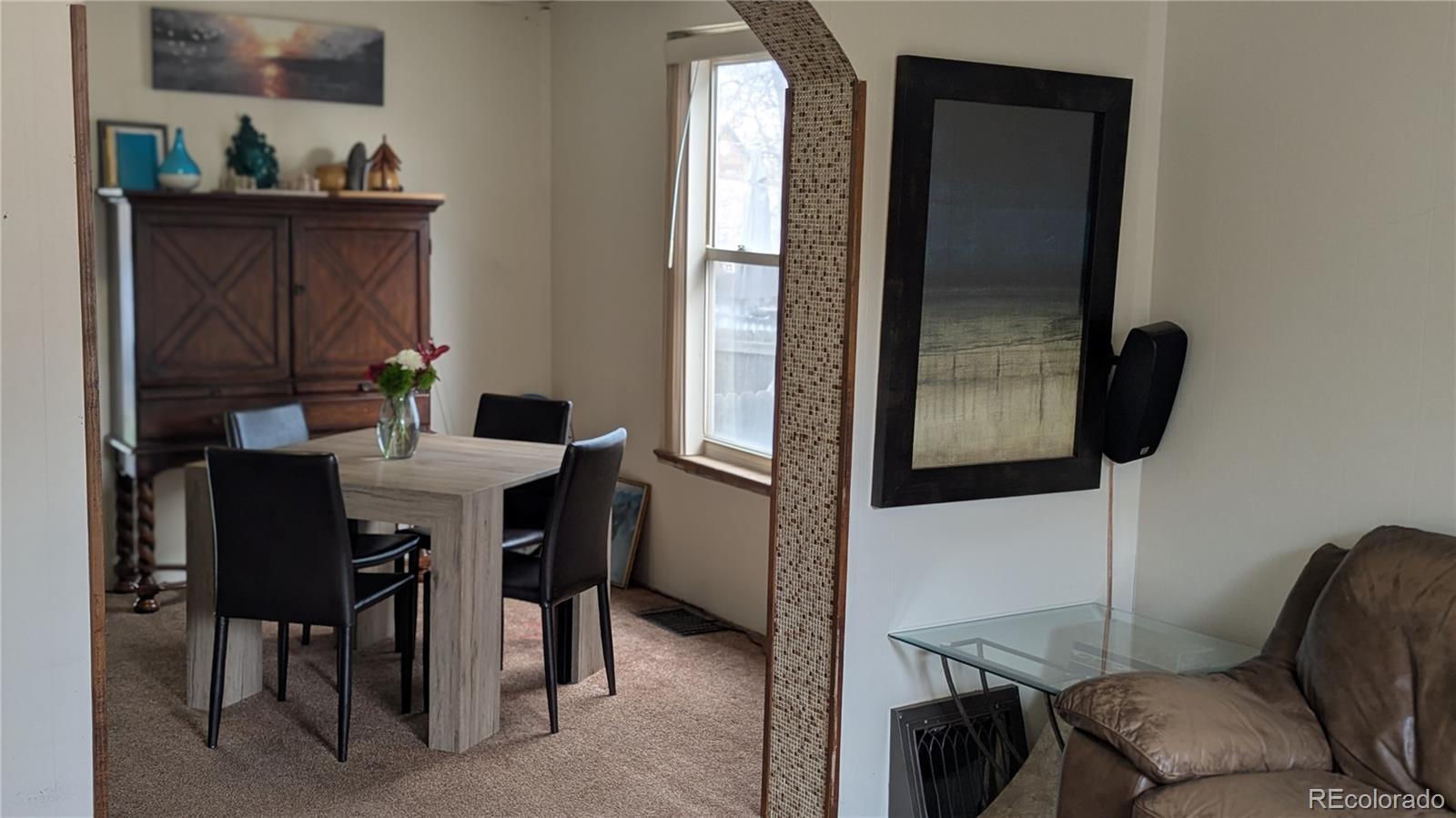 3924 Jason Street Denver, CO 80211 - Photo 14 of 26 a dining room with furniture and window
