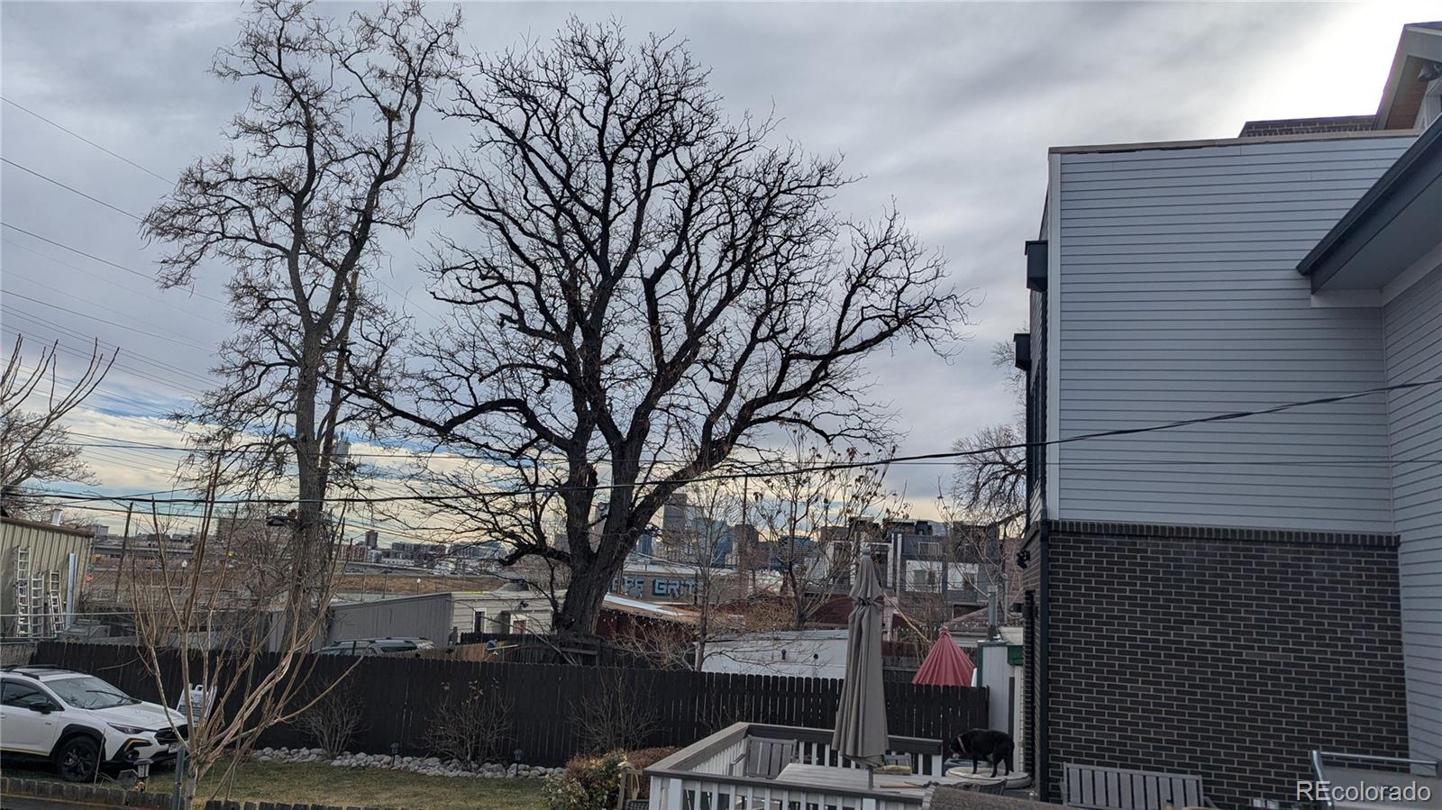 3924 Jason Street Denver, CO 80211 - Photo 24 of 26 a view of a house with a yard