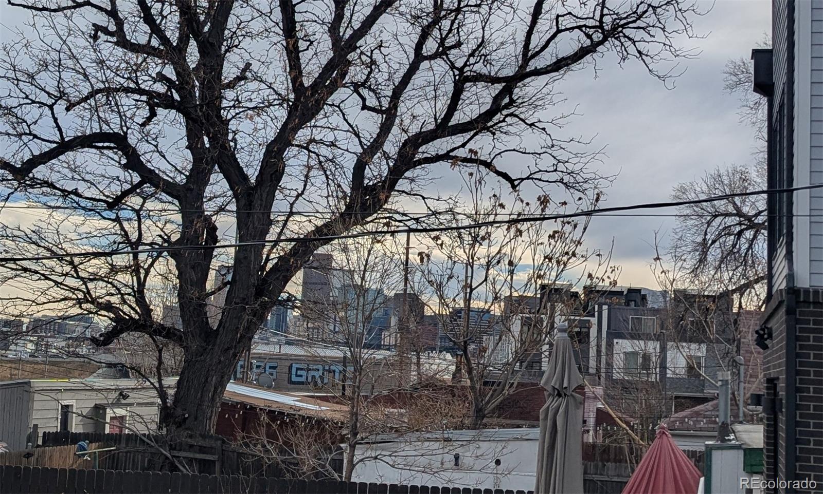 3924 Jason Street Denver, CO 80211 - Photo 25 of 26 a view of a street with a tree