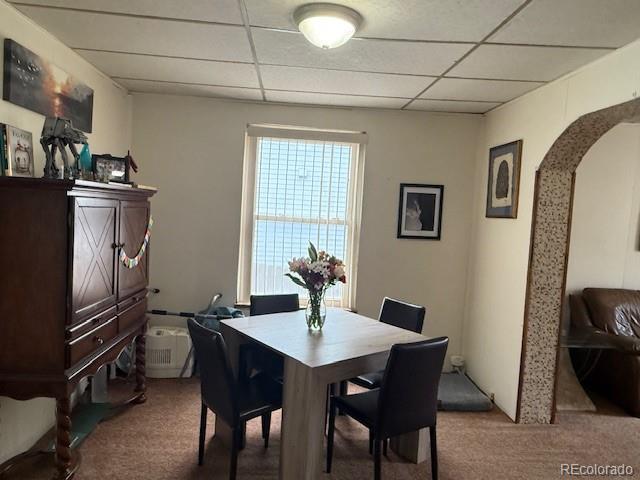 3924 Jason Street Denver, CO 80211 - Photo 3 of 26 a kitchen with a table and chairs in it