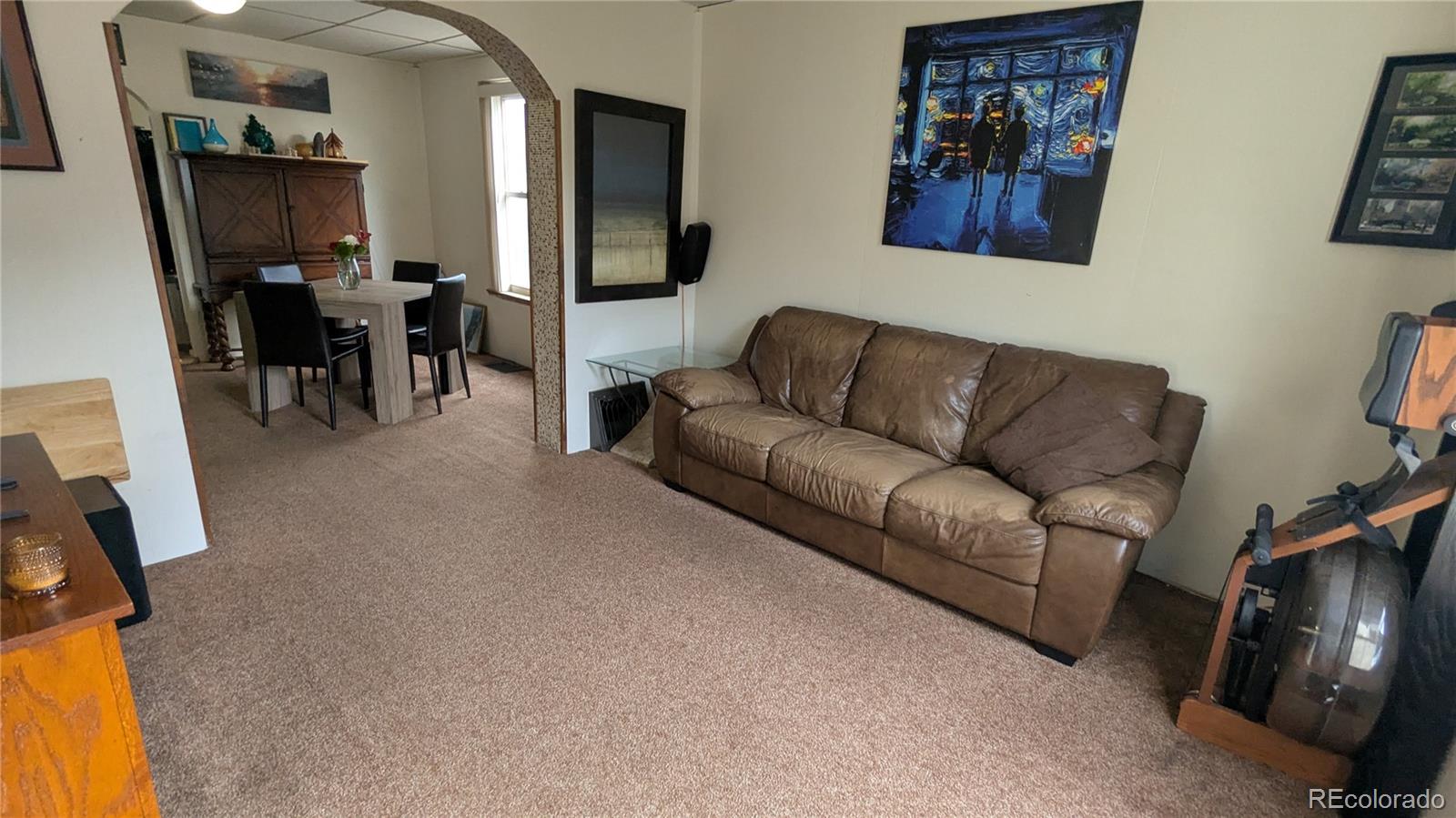 3924 Jason Street Denver, CO 80211 - Photo 5 of 26 a living room with furniture and a flat screen tv