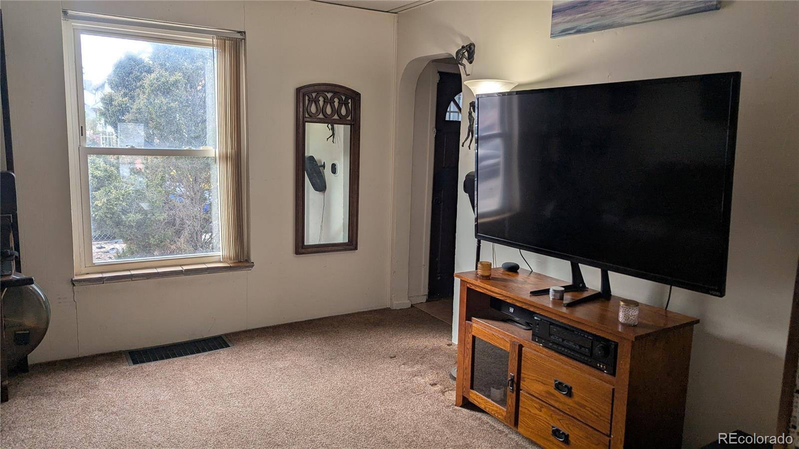 3924 Jason Street Denver, CO 80211 - Photo 8 of 26 a room with window and wardrobe