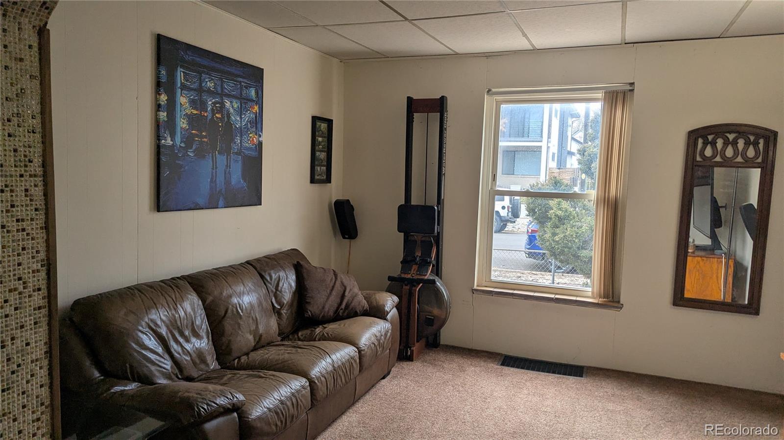 3924 Jason Street Denver, CO 80211 - Photo 9 of 26 a living room with furniture and a window
