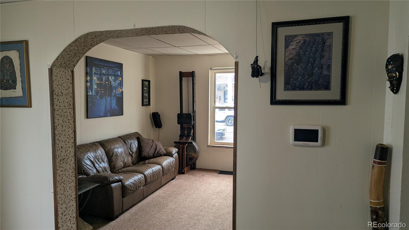 3924 Jason Street Denver, CO 80211 - Photo 10 of 26 a living room with furniture and a flat screen tv