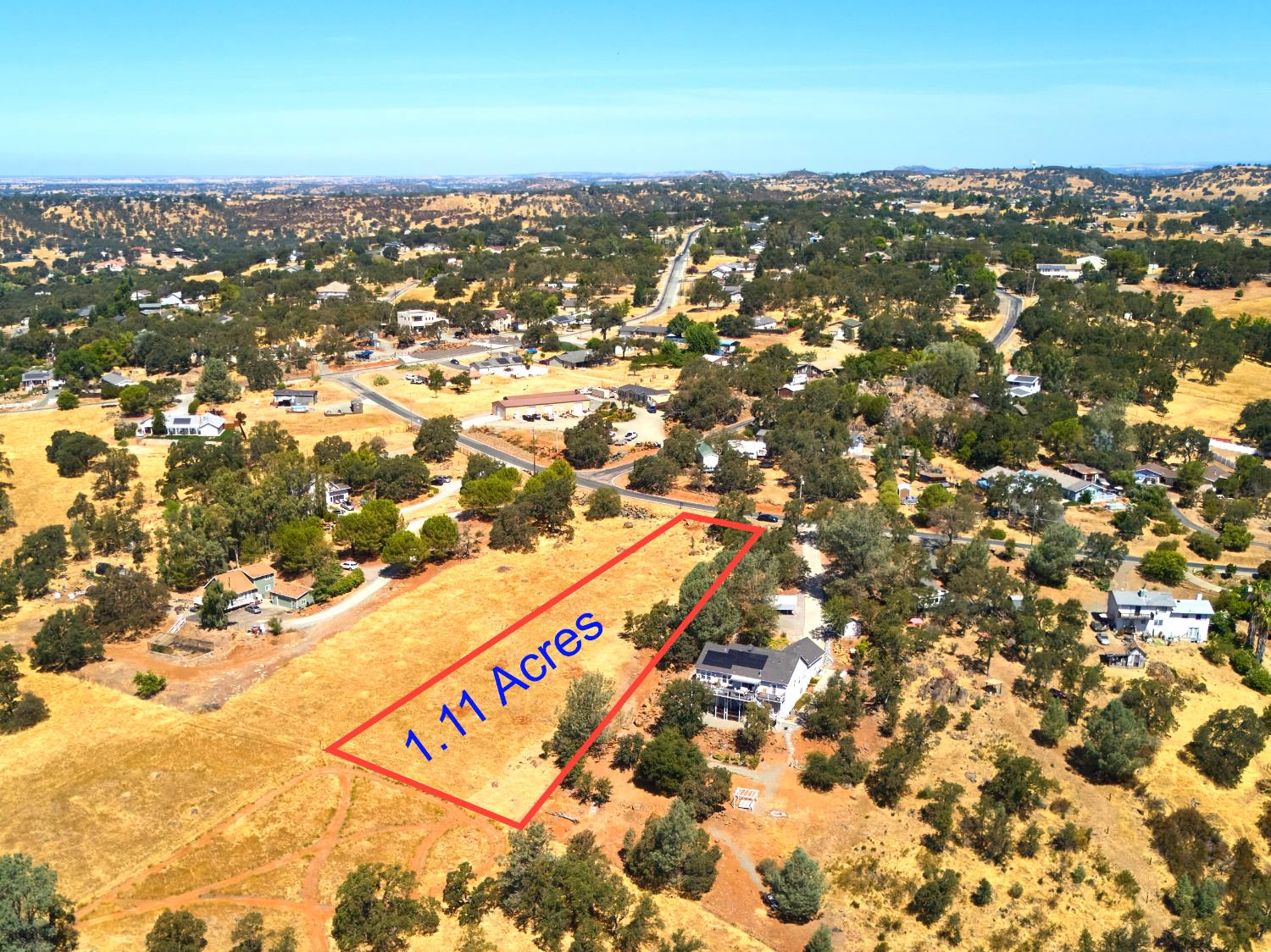 7033 Cane Lane Valley Springs, CA 95252 - Photo 10 of 14 an aerial view of residential building with parking space