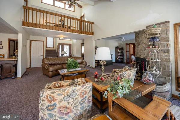 a view of a dining room with furniture and a livingroom