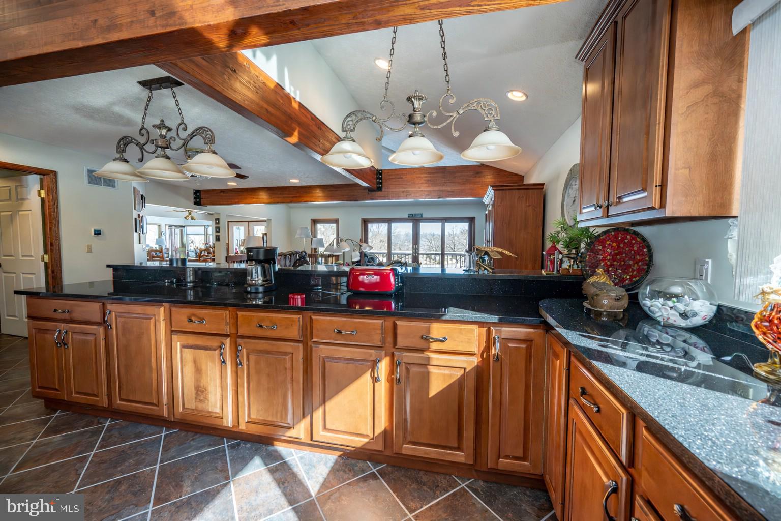 815 Chadderton School Road Oakland, MD 21550 - Photo 15 of 110 a kitchen with stainless steel appliances granite countertop a sink and cabinets