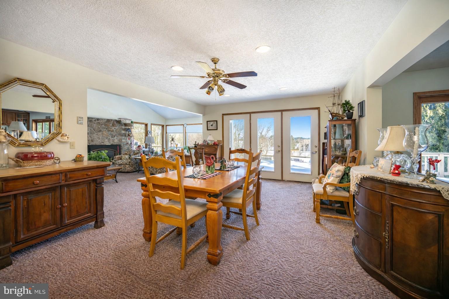 815 Chadderton School Road Oakland, MD 21550 - Photo 21 of 110 a living room with furniture a dining table and kitchen view