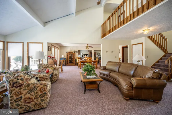 a bedroom with a bed chair and window
