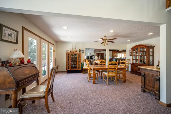 a view of an entryway wooden floor and windows