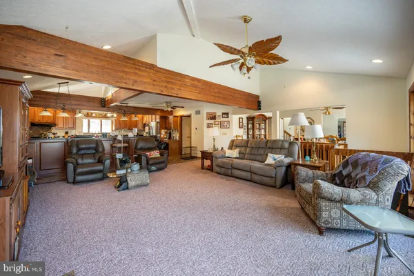 a bedroom with a bed and dresser with mirror