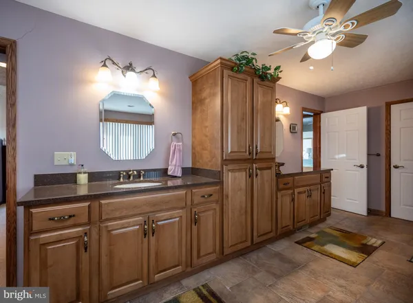 a bathroom with a window and a shower