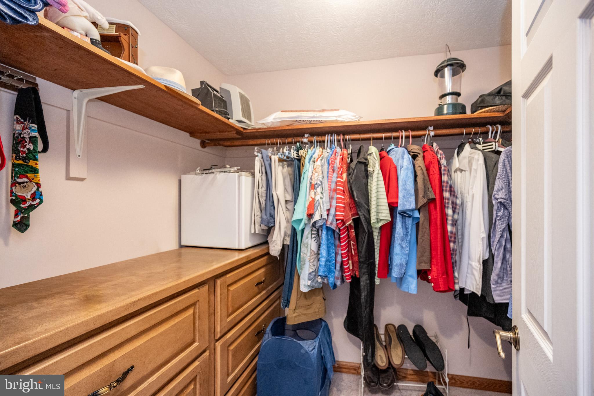 815 Chadderton School Road Oakland, MD 21550 - Photo 41 of 110 a view of walk in closet with clothes