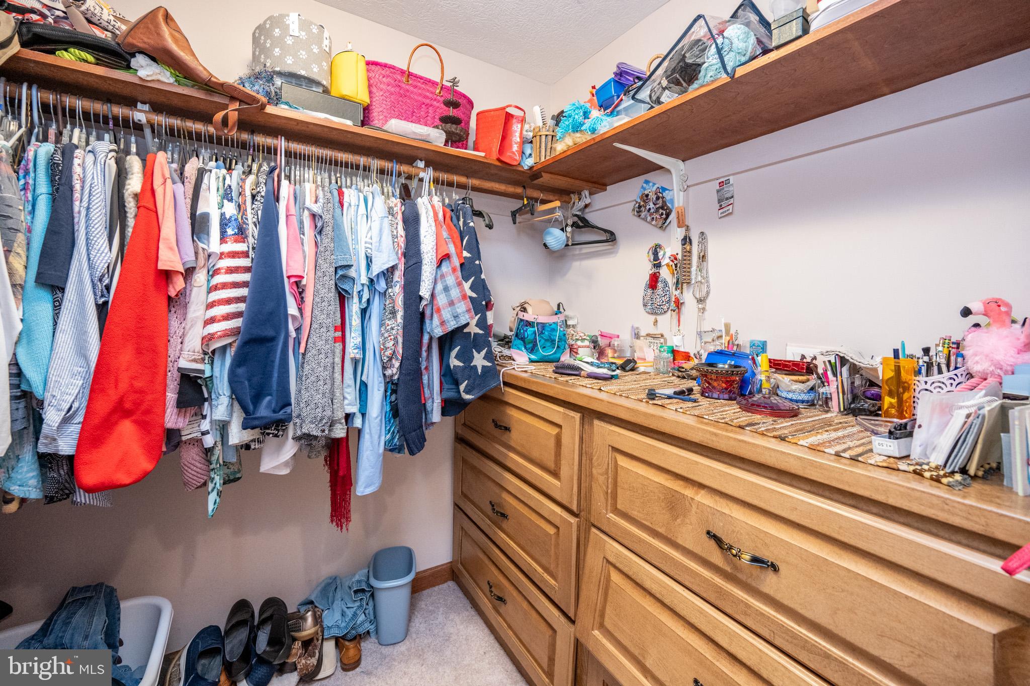 815 Chadderton School Road Oakland, MD 21550 - Photo 47 of 110 a view of walk in closet with clothes and shoes