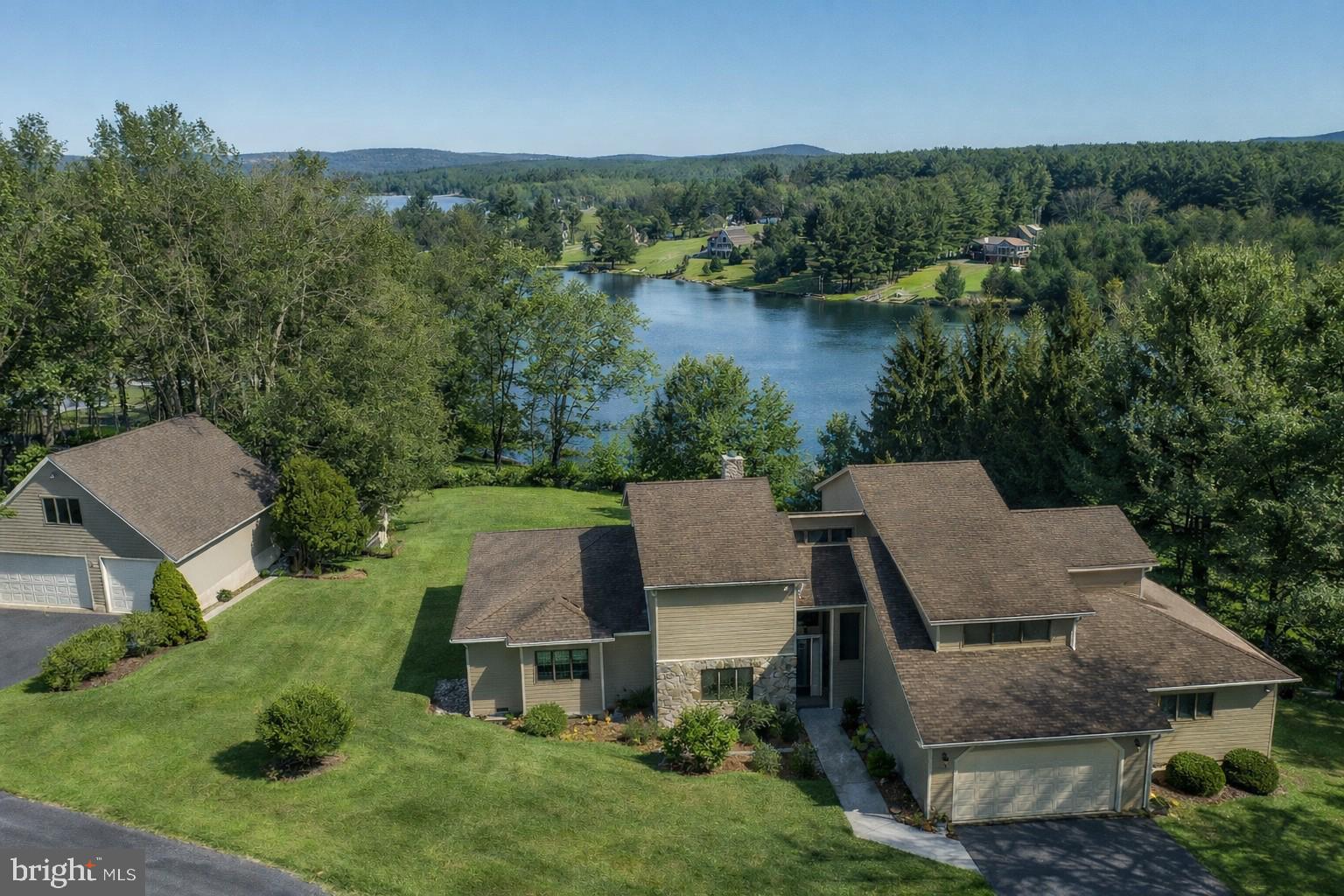 815 Chadderton School Road Oakland, MD 21550 - Photo 81 of 110 an aerial view of a house with pool garden and lake view