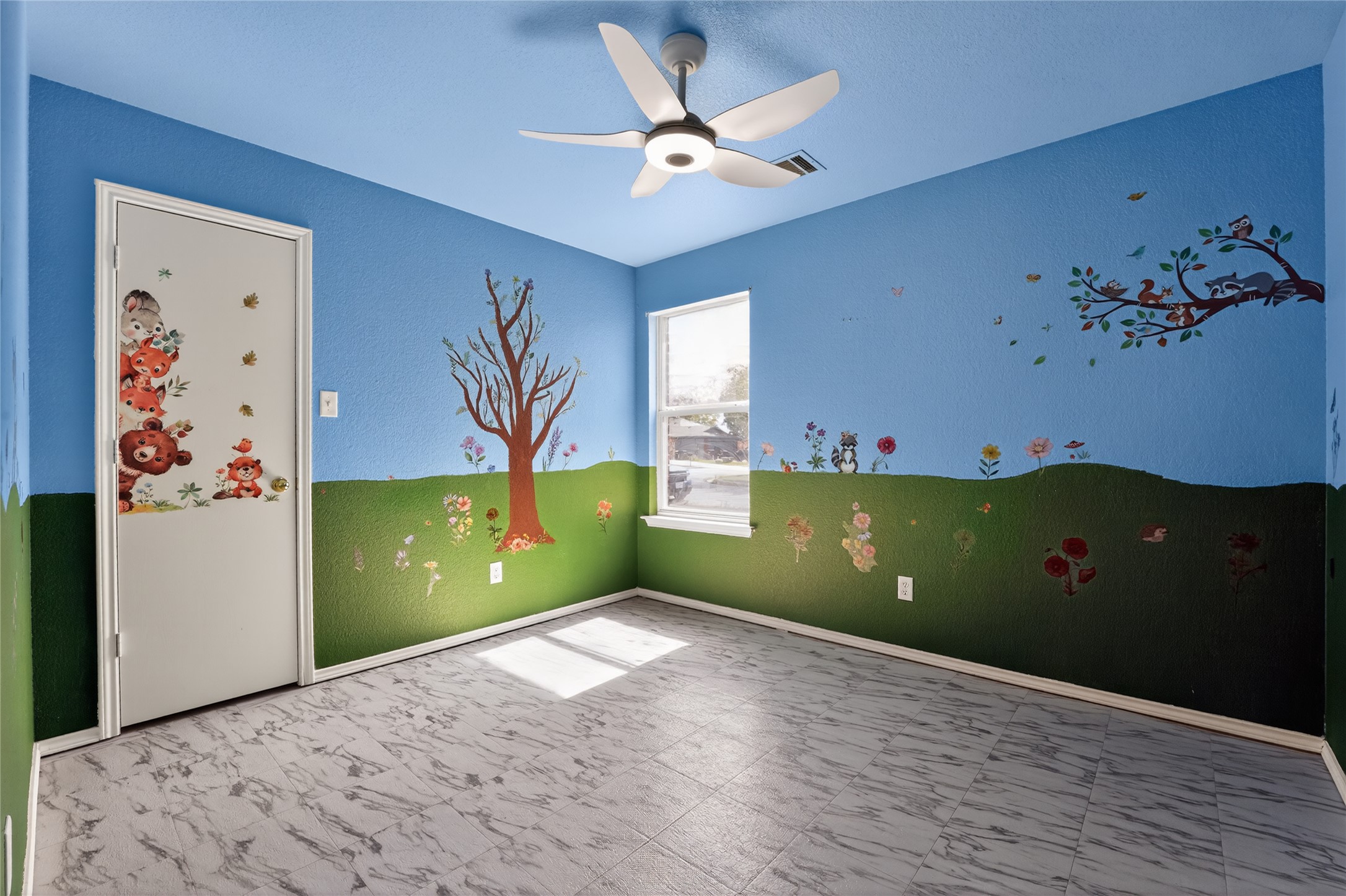 152 Eagle Drive Luling, TX 78648 - Photo 22 of 31 an empty room with painting and a chandelier fan