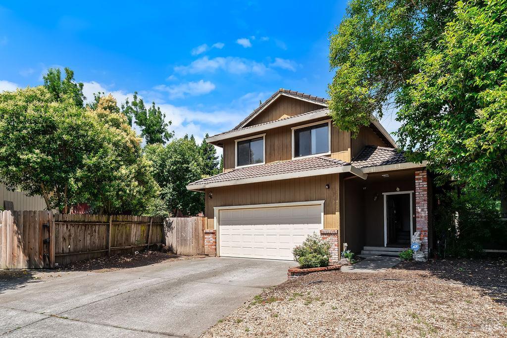 715 Placer Court Santa Rosa, CA 95401 - Photo 32 of 37 a front view of a house with a yard and garage