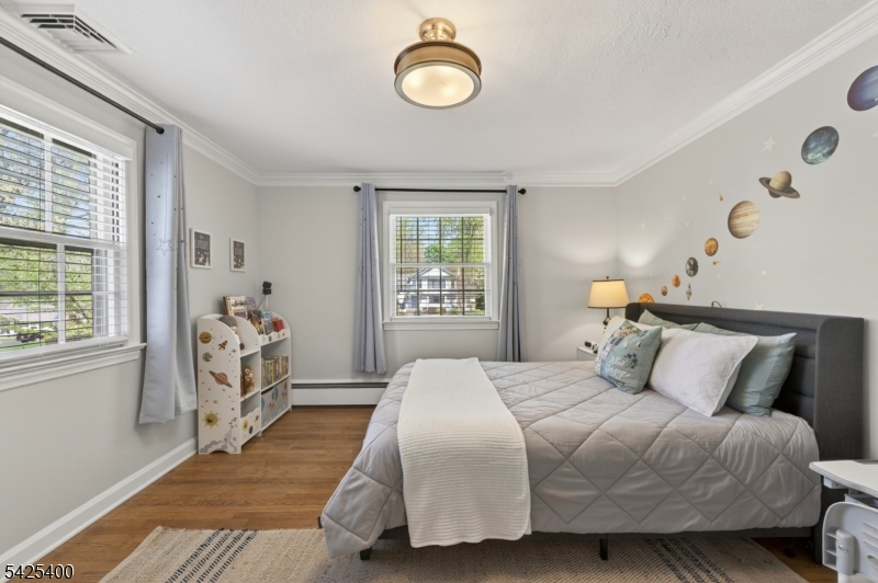 28 Spring Ridge Drive Berkeley Heights, NJ 07922 - Photo 23 of 46 a bedroom with a bed and a window