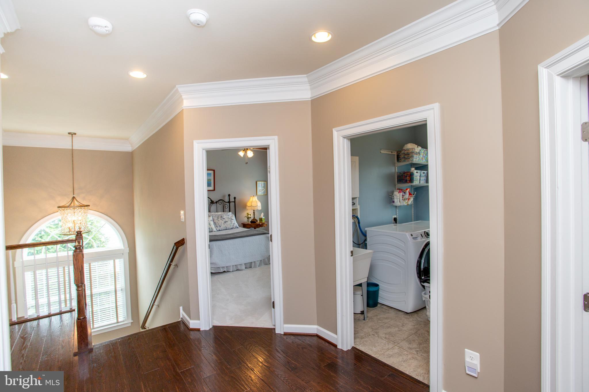 4682 Plough Tavern Road Doylestown, PA 18902 - Photo 30 of 42 a view of a hallway with wooden floor and a dining room