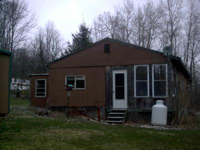 330 Stone Hill Road Oneonta, NY 13820 - Photo 1 of 1 Covered porch overlooks woods full of wildlife on