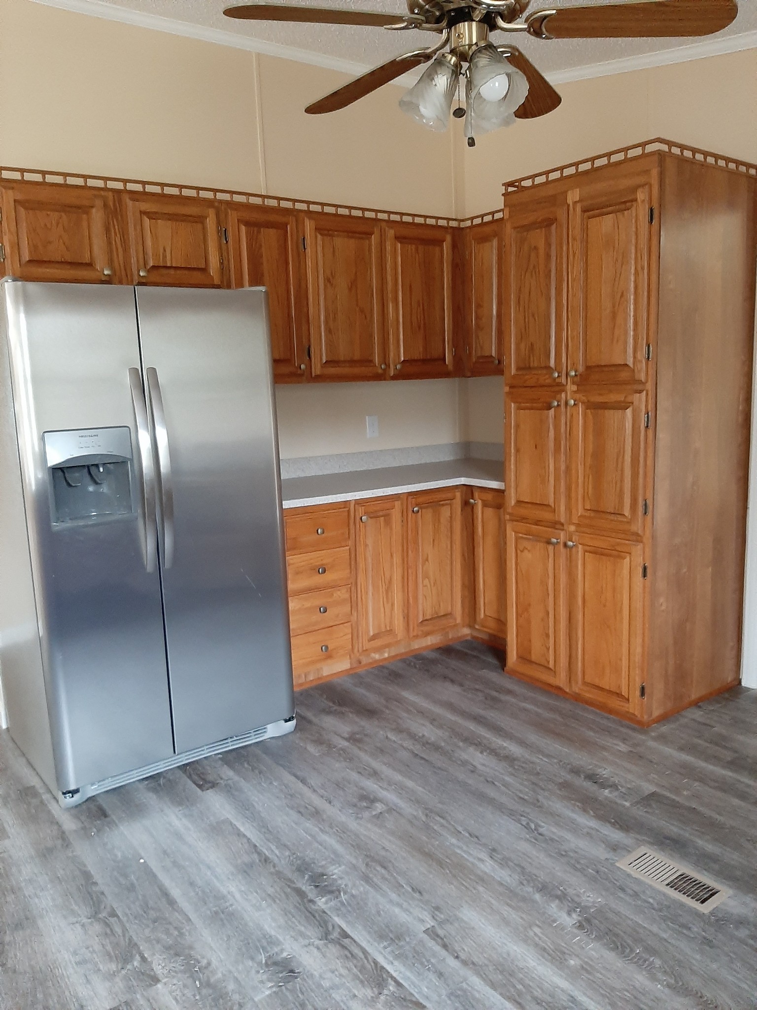 4354 Cainsville Road Lebanon, TN 37090 - Photo 24 of 26 a view of a kitchen with wooden floor a ceiling fan
