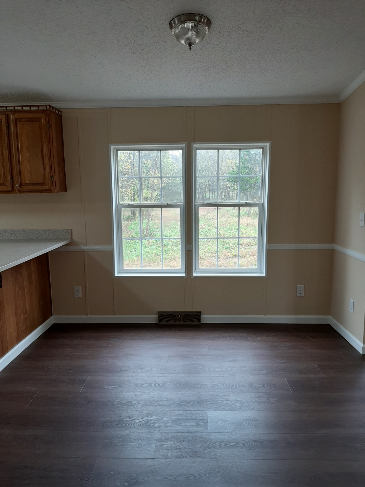 4354 Cainsville Road Lebanon, TN 37090 - Photo 10 of 26 an empty room with wooden floor and windows