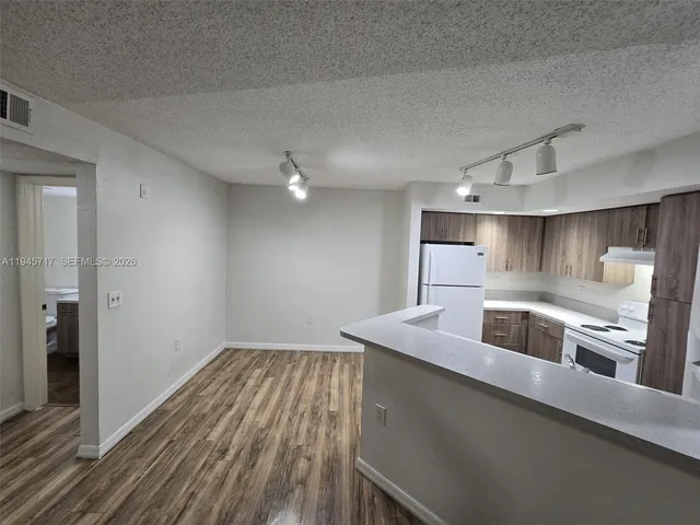 a kitchen with a sink and cabinet