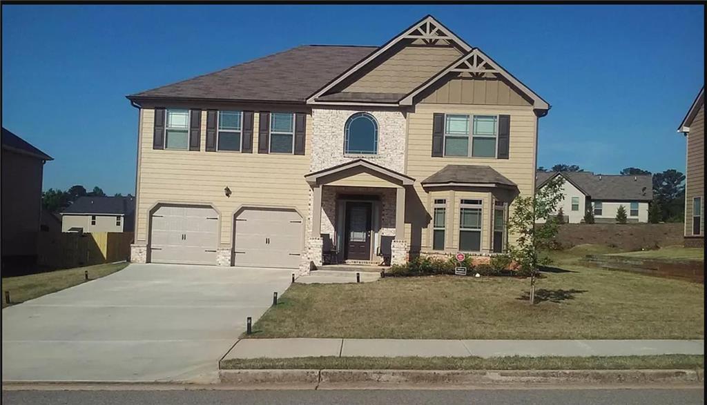 6879 Dresden Drive Rex, GA 30273 - Photo 1 of 1 a front view of a house with a yard