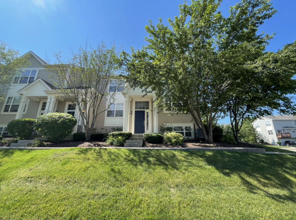 34337 North Barberry Road Round Lake Beach, IL 60073 - Photo 14 of 15 a front view of house with yard and green space
