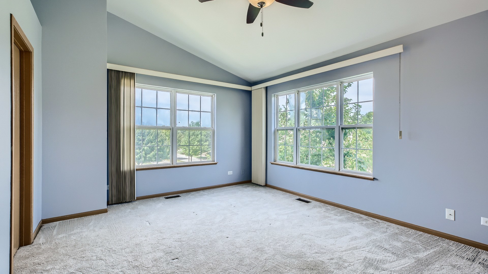 34337 North Barberry Road Round Lake Beach, IL 60073 - Photo 8 of 15 an empty room with windows and ceiling fan