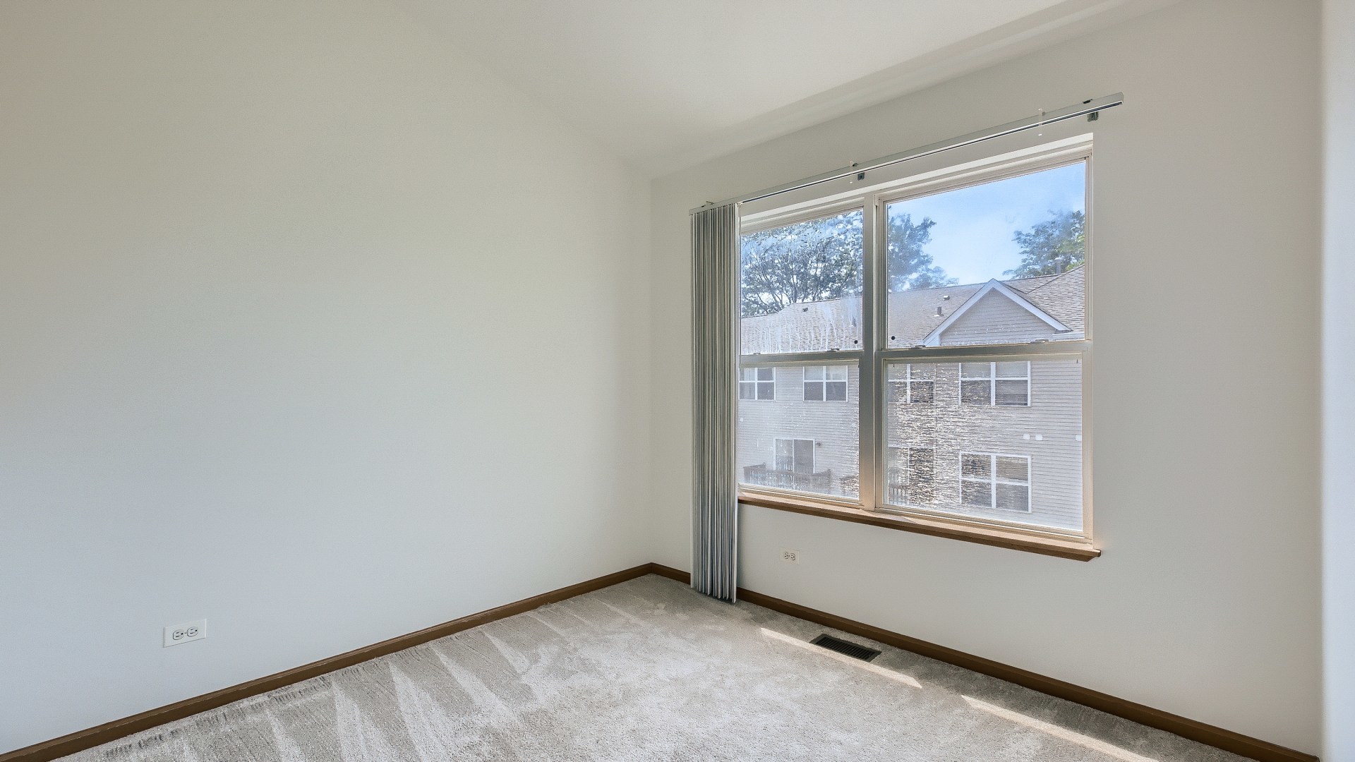 34337 North Barberry Road Round Lake Beach, IL 60073 - Photo 9 of 15 an empty room with windows