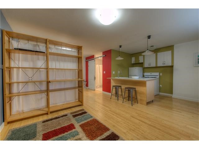 304 East 33rd Street, Unit 2 Austin, TX 78705 - Photo 11 of 12 a view of a kitchen with furniture and a ceiling fan