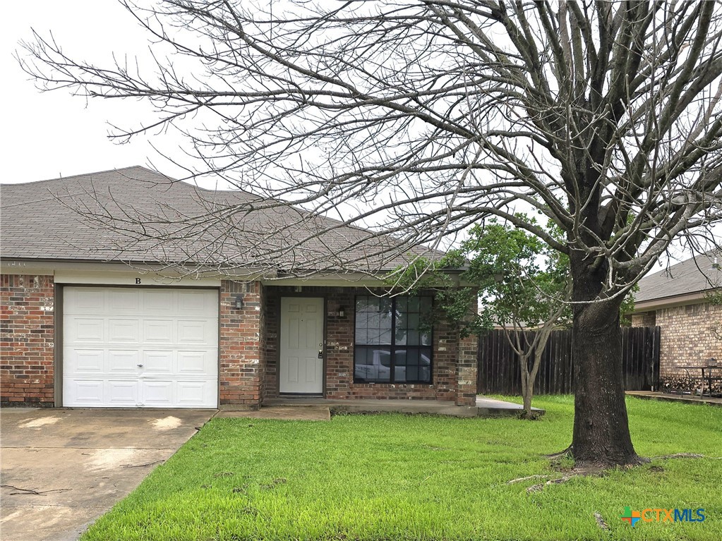 1411 Nicholas Circle, Unit B Killeen, TX 76542 - Photo 1 of 23 a view of a yard in front of house