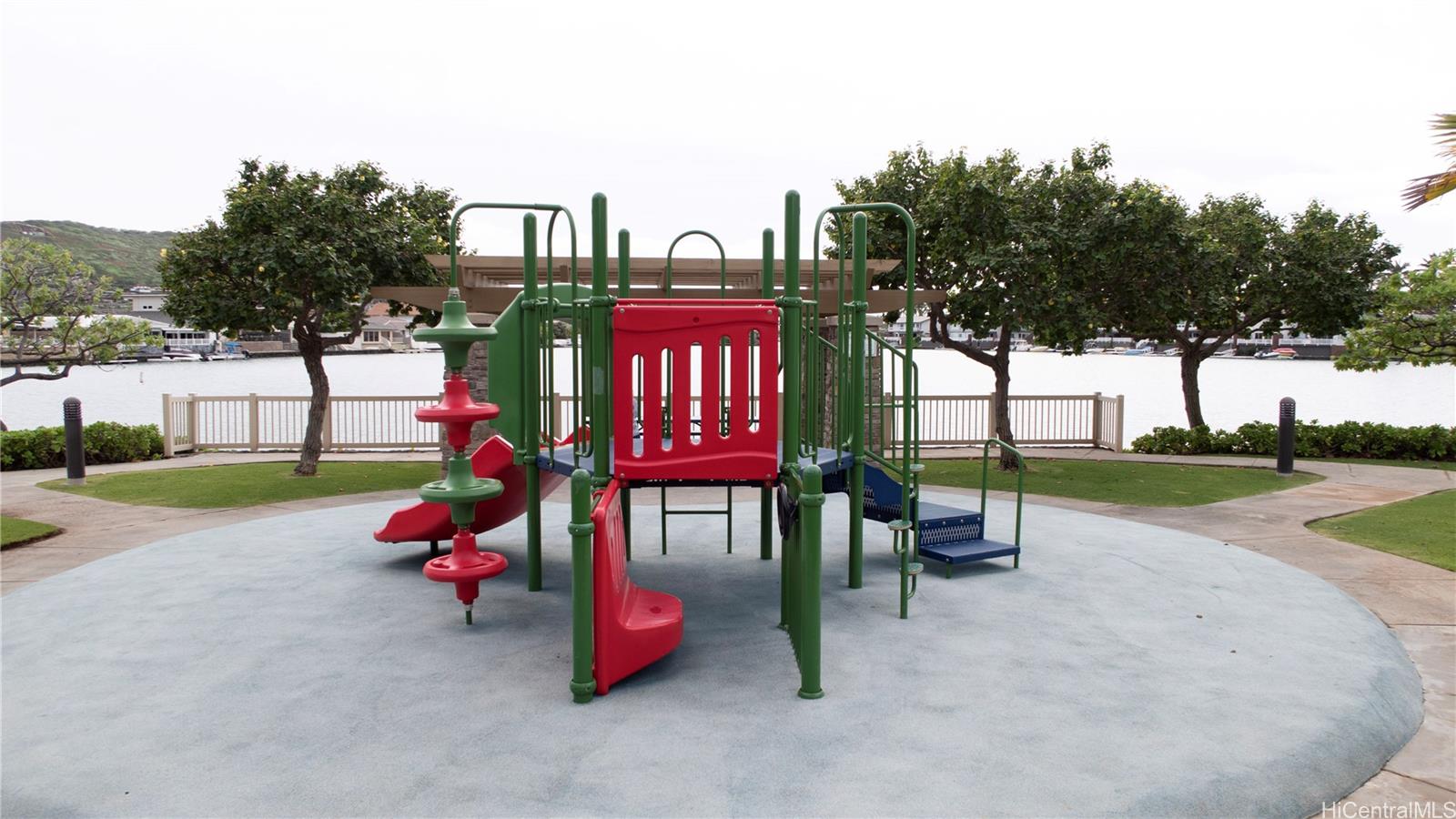 520 Lunalilo Home Road, Unit 7107 Honolulu, HI 96825 - Photo 19 of 21 a childrens park with lots of swings slides and swimming pool in the back