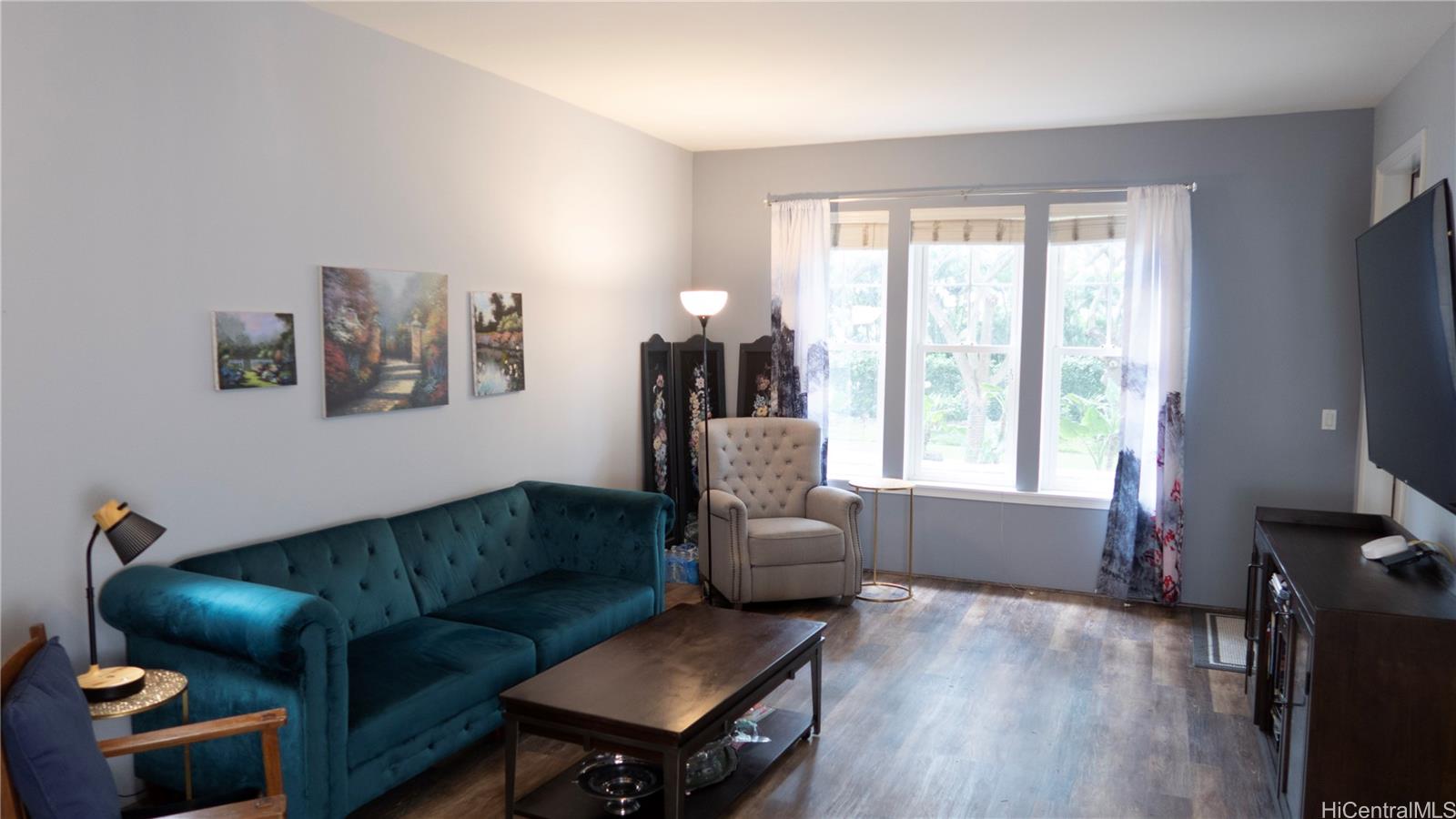 520 Lunalilo Home Road, Unit 7107 Honolulu, HI 96825 - Photo 6 of 21 a living room with furniture and a window