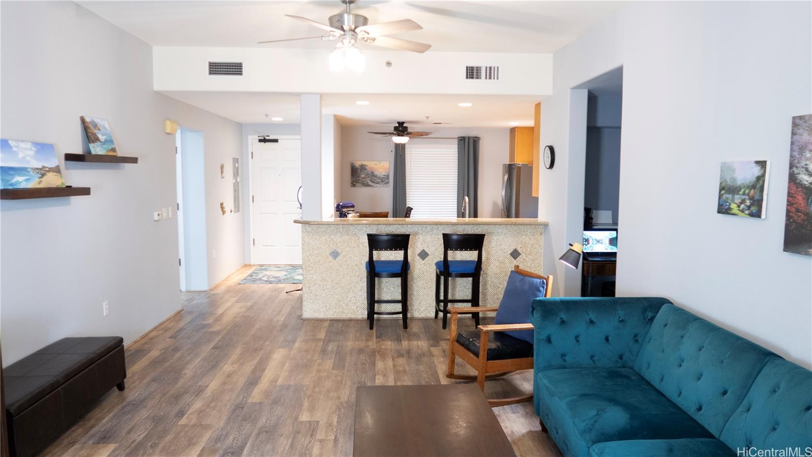 520 Lunalilo Home Road, Unit 7107 Honolulu, HI 96825 - Photo 7 of 21 a living room with furniture and wooden floor