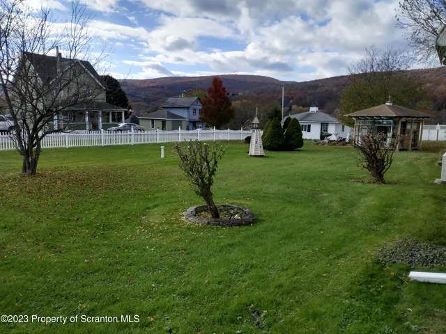 a view of a fountain in front of house
