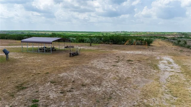 a view of a lake with a yard