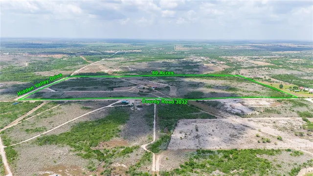 a view of a yard with an ocean